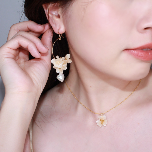 Handmade Japanese Ajisai Hydrangea Flower Earrings by Lilyna, featuring gold-filled hoops with a delicate flower petal design and a drop of freshwater pearl, perfect for sensitive skin and bridal scenes.