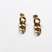 A pair of gold-toned chunky chain link drop earrings on a plain white background.