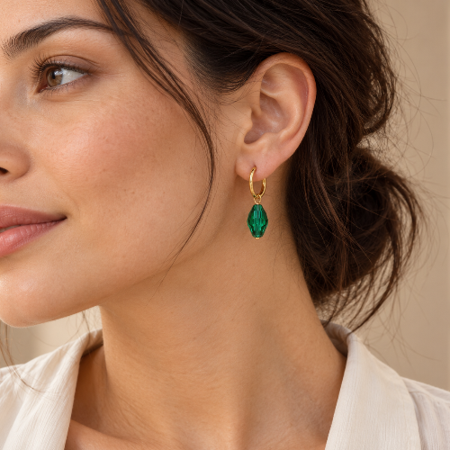 Model wears handmade emerald green crystal charms hoop earrings 