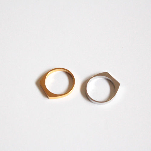 Two gold and silver rings on a white background