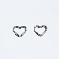 silver heart hoop earrings, dainty, and one touch design. 