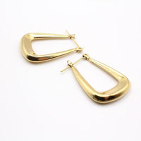 Close up of 24k gold plated hoop earrings with minimalist and bold design, perfect for everyday wear.