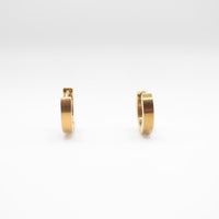 a pair of one touch hoop earrings 24k gold plated. showcasing their minimalist elegant design 