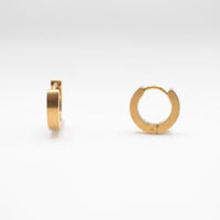 a pair of one touch hoop earrings 24k gold plated. showcasing their minimalist elegant design 