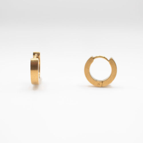 a pair of one touch hoop earrings 24k gold plated. showcasing their minimalist elegant design 