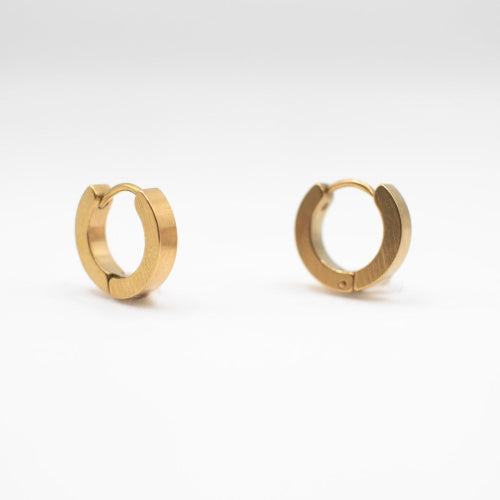 a pair of one touch hoop earrings 24k gold plated. showcasing their minimalist elegant design 