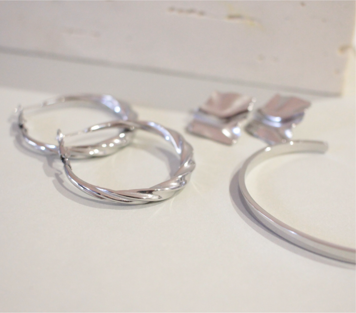 Rhodium plated silver twist hoop earrings for daily wear 